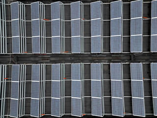 Obraz premium extensive roof of industrial and logistic hall are gradually being filled with solar panels. covering roofs helps industrial developer increase energy efficiency and sustainability site, building 