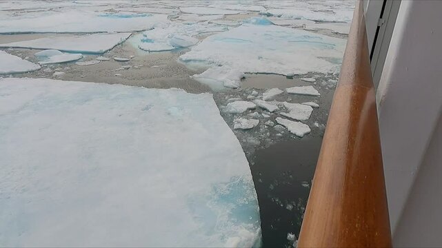 POV from ship while sailing through arctic sea ice