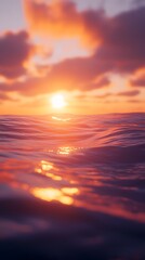 Obraz premium A vibrant sunrise over a calm ocean with soft waves and no boats