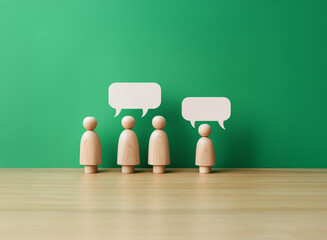 Wooden figures stand in a row before a green background, each with a blank speech bubble above them, suggesting communication or discussion.