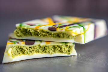 Trend Dubai white chocolate with pistachio paste and kataifi dough. Confectionery handmade sweets at home in the kitchen. 
