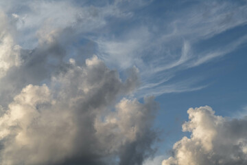 Mixed white and gray clouds on a blue sky in Israel.
