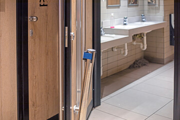 functional toilet room in a fast food restaurant