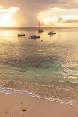 Moored fishing boats at the beach of Sint Michiel, Curaçao. Impressing cloudscape during sunset