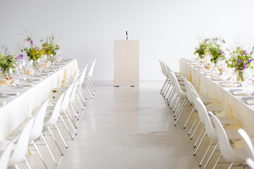 wedding reception podium against a white wall