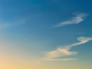 Soft Autumn Sunrise Tinging the High Clouds with Golden Light