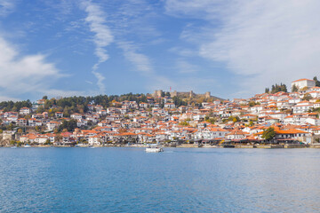 Fototapeta premium Picturesque view of Ohrid, North Macedonia, a historic town on Lake Ohrid shore, known for its charming architecture and stunning lake views, making it a popular tourist destination.