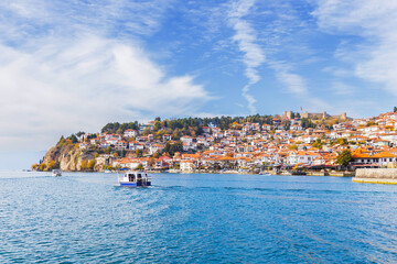 Picturesque view of Ohrid, North Macedonia, a historic town on Lake Ohrid shore, known for its charming architecture and stunning lake views, making it a popular tourist destination.