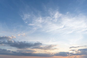 Beautiful morning or evening blue and orange sky with cloudy while sunsets or sunrises taken at the sea used as natural blackground texture
