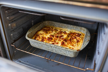 Lasagna Baking in Oven