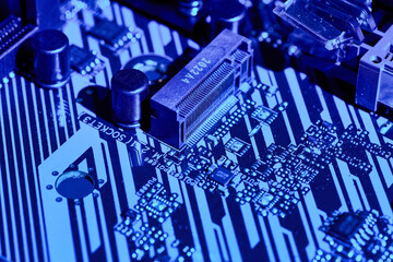 Close-up of Components on a Blue-lit Motherboard