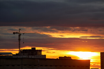 Silhouettes of Buildings Against a Fiery Sunset