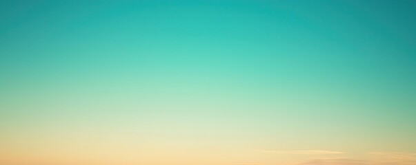Obraz premium Sky gradient with turquoise and orange hues at sunset.