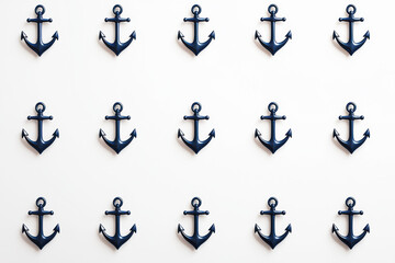 Minimalist nautical pattern with navy blue anchors on white background captures modern elegance and subtlety in design
