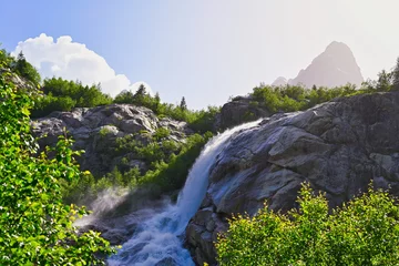 Foto op Canvas Sunset landscape of Alibek waterfall in the mountains © pdeminhiker