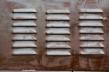 Brown metal grille ventilation holes lattice