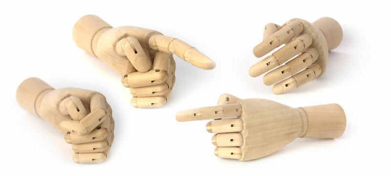 Set  of wooden hands of mannequins  for drawing showing different gestures isolated on white background.