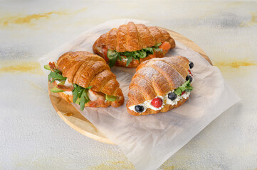 fresh croissant with filling on background