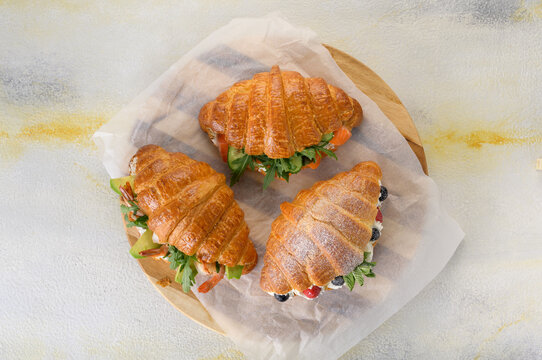 fresh croissant with filling on background
