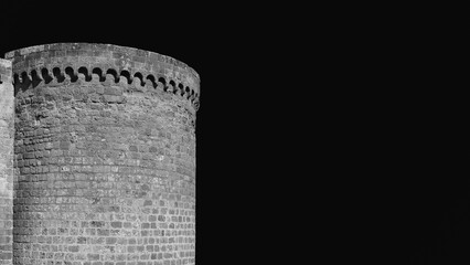 Medieval military architecture in Italy. Orvieto ancient city walls with round tower Black and White with copy space) © crisfotolux
