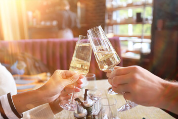 Glasses of sparkling wine, the hands of friends.