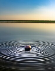 静かな池の水面に小石が落ちた瞬間、同心円状の波紋が広がるテクスチャ