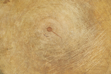Old grunge wooden kitchen cutting board as background, chopping board close-up.