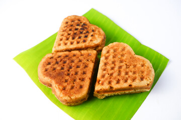 Tasty golden-brown waffle on a clean white background, perfect for breakfast or dessert