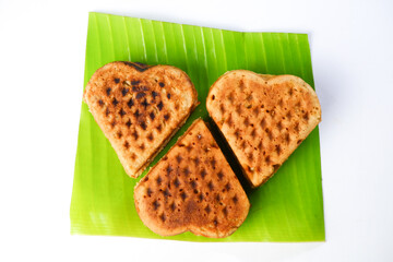 Tasty golden-brown waffle on a clean white background, perfect for breakfast or dessert