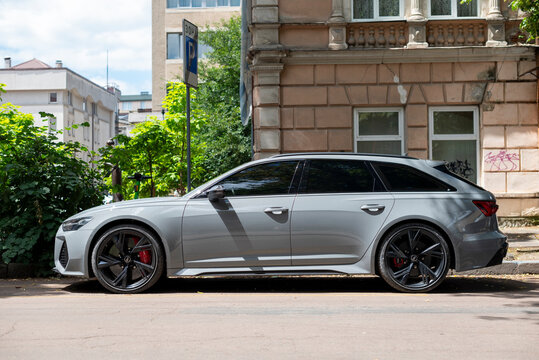 Ivano-Frankivsk, Ukraine - 24 June 2024: Grey Audi RS6 (c8) is a high-performance variant of the Audi A6. Executive sport station wagon car, from side view. Car parking on city street