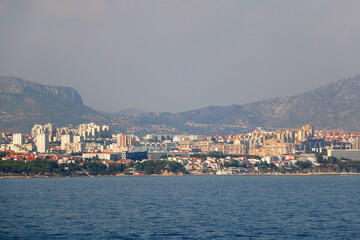 Fototapeta premium Contemporary buildings, gardens and beaches at the waterfront in Split, Croatia. View of Split from the boat.