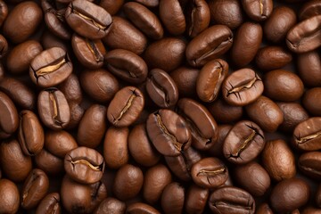 Close up view of roasted coffee beans creating a rich, textured background, ideal for cafe promotions and coffee related marketing materials