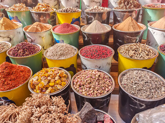 Large choice of colorful spices in the traditional arabian market in Dubai