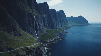 Coastal road beside waterfall, cliffs, ocean.  Travel, nature background