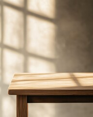 Empty wooden table with sunlit window background.
