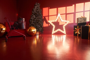 Christmas decor with sun rays. The room's New Year's decor is decorated in red tones. Christmas tree in the interior of the house in red and gold tones with space for copying. High quality photo