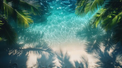 Obraz premium Tropical Beach Paradise: Turquoise Waters and Palm Tree Shadows