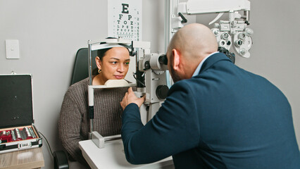 Optometrist Conducting a Professional Eye Examination in a Modern Clinic