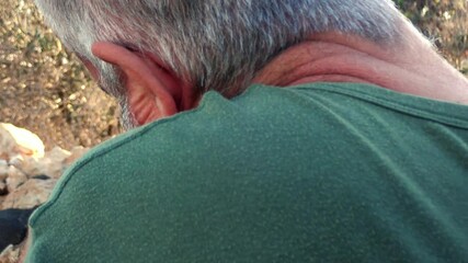 Deployed beared soldier receives in his phone a Valentine's Day greeting with the colors of the Progress Pride flag and send a loving hug and kiss to his lover. Non-toxic masculinity.
