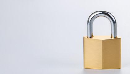 Naklejka premium Golden padlock on light backdrop. Security, safety and protection concept.