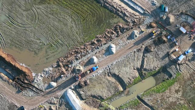 Topdown of street construction earth work with heavy machinery