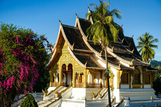 The Magnificent Haw Pha Bang Temple in Luang Prabang, Laos – A Dazzling Masterpiece of Buddhist Architecture Amidst Lush Tropical Scenery in Southeast Asia