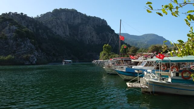Tourist sightseeing boats in Dalyan canal. Ortaca district, Mugla province, Turkey country 