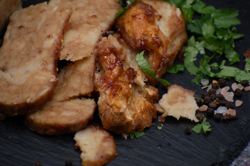 Seitan: vegan meat alternative made with vital wheat gluten, sliced on slate board