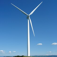 Fototapeta premium Majestic wind turbine stands tall against a vibrant blue sky on a sunny day