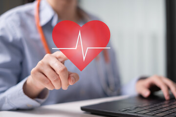 Professional healthcare medical worker holding red heart with cardiogram cardiologist concept