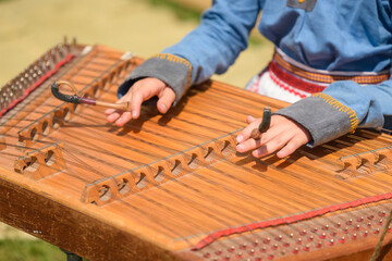 Top View of Woman&rsquo;s Hands Playing Ancient Gusli String Instrument