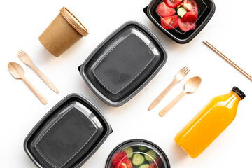 Tomatoes salad in plastic delivery tray, top view. Catering concept