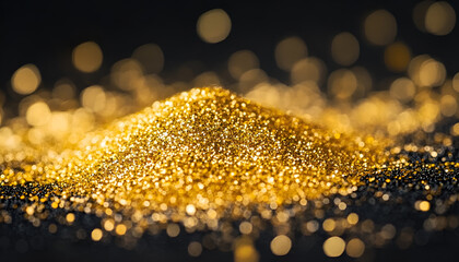 Golden glitter dust sparkles on a black background, symbolizing luxury and celebration of various festive events