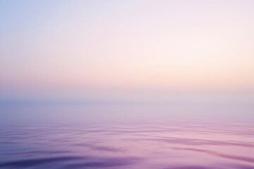 Obraz premium Serene pastel sunset over calm waters, reflecting soft colors in a tranquil coastal landscape